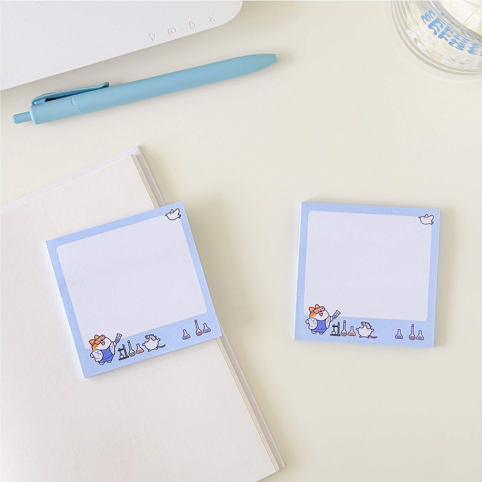 Cute science sticky notes featuring cartoon lab animals, chemistry glassware, and a pastel blue memo pad design.
