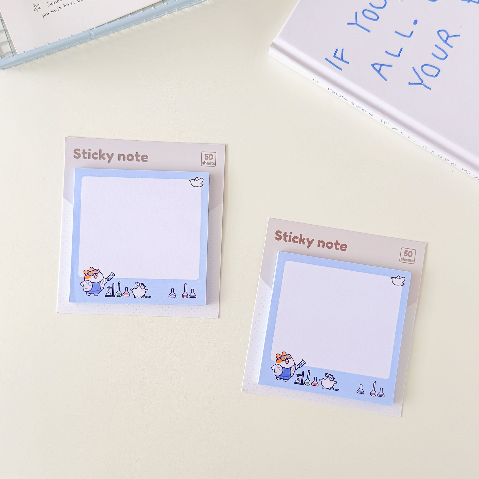 Cartoon lab animal sticky notes with a clean writing space, scientific equipment graphics, and soft blue stationery design.