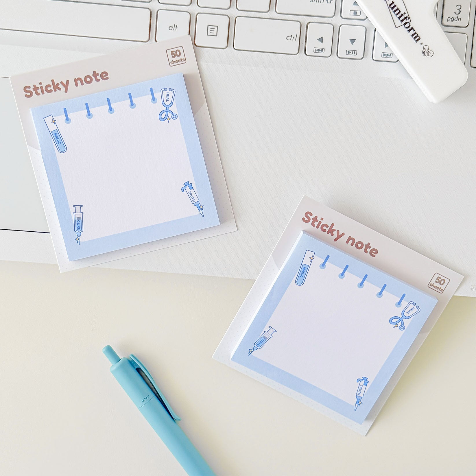 Blue laboratory memo sticky notes with science-themed corner illustrations and spacious blank space for writing.