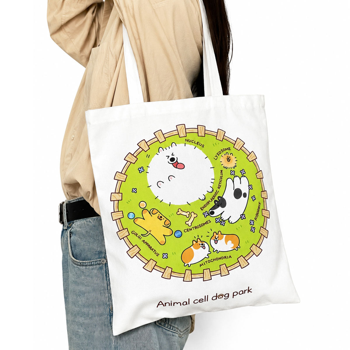 Science-inspired reusable tote bag decorated with a whimsical animal cell and cartoon dog artwork for biology enthusiasts and STEM education.