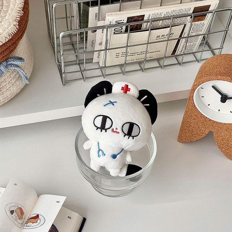 White nurse cat plush collectible with embroidered stethoscope, nurse hat, and premium plush texture.