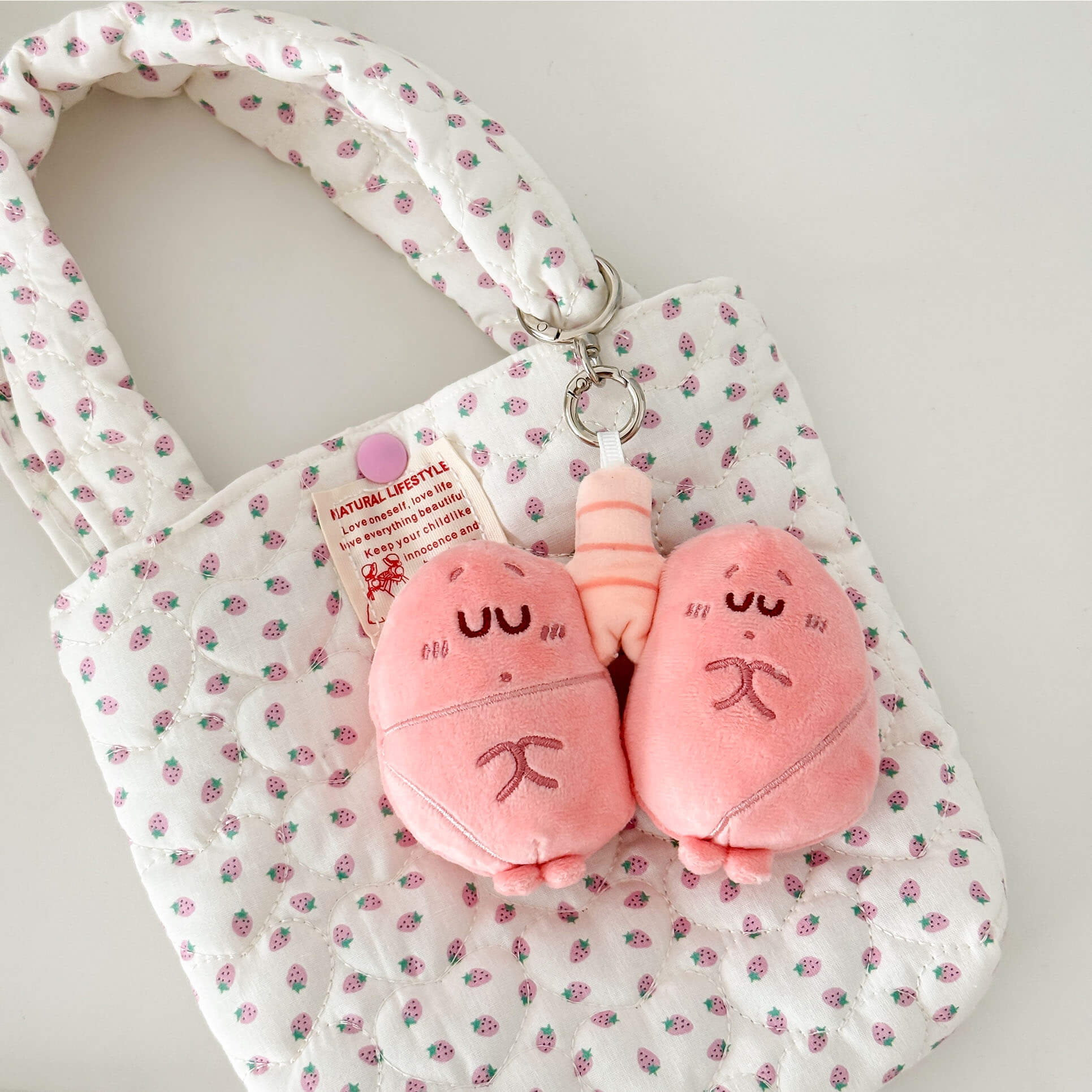 Adorable anatomy lung plush keychain with soft fabric, cute face, and silver keychain