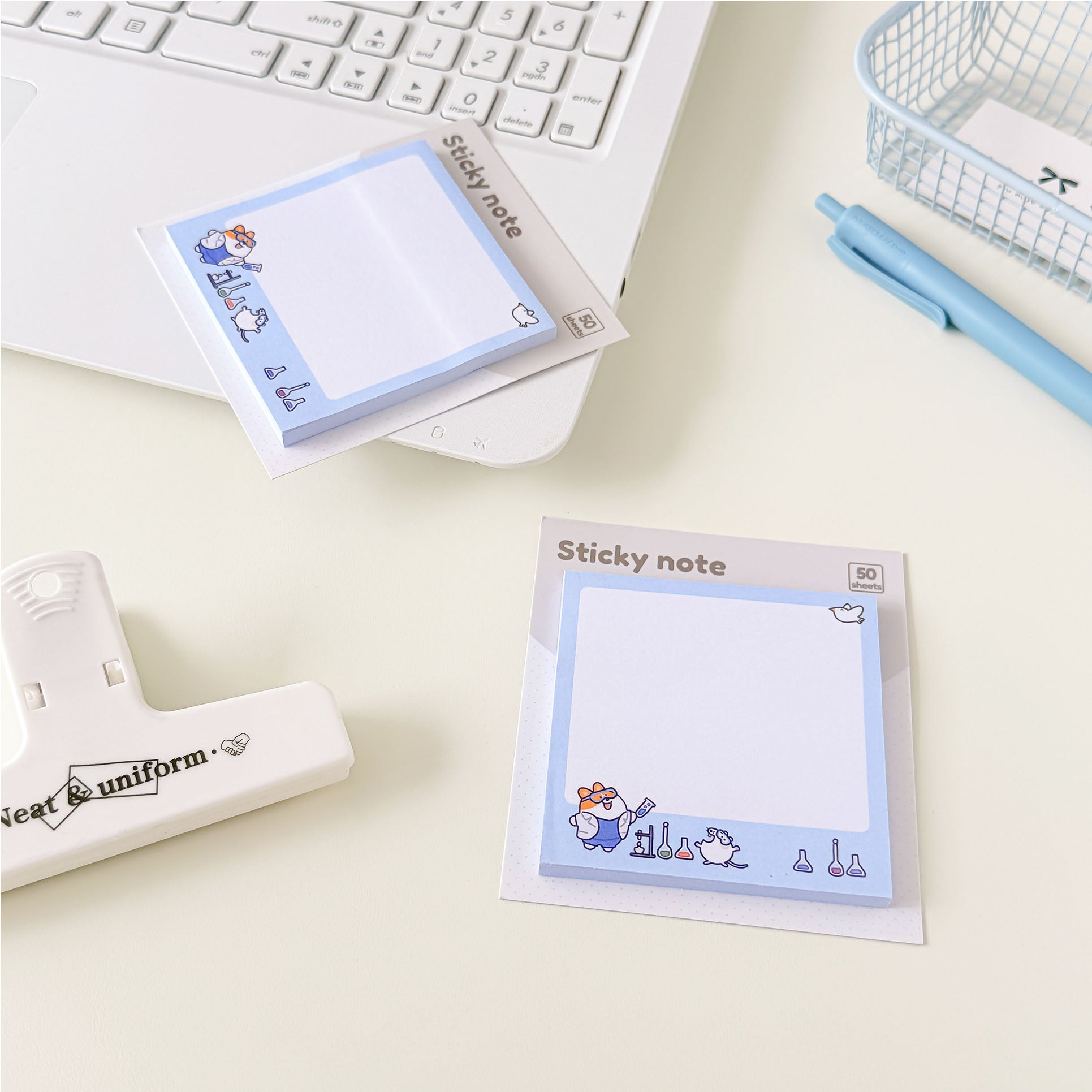 Laboratory-themed memo pad with adorable animal characters, blue border, and science-inspired illustrations for office and study.