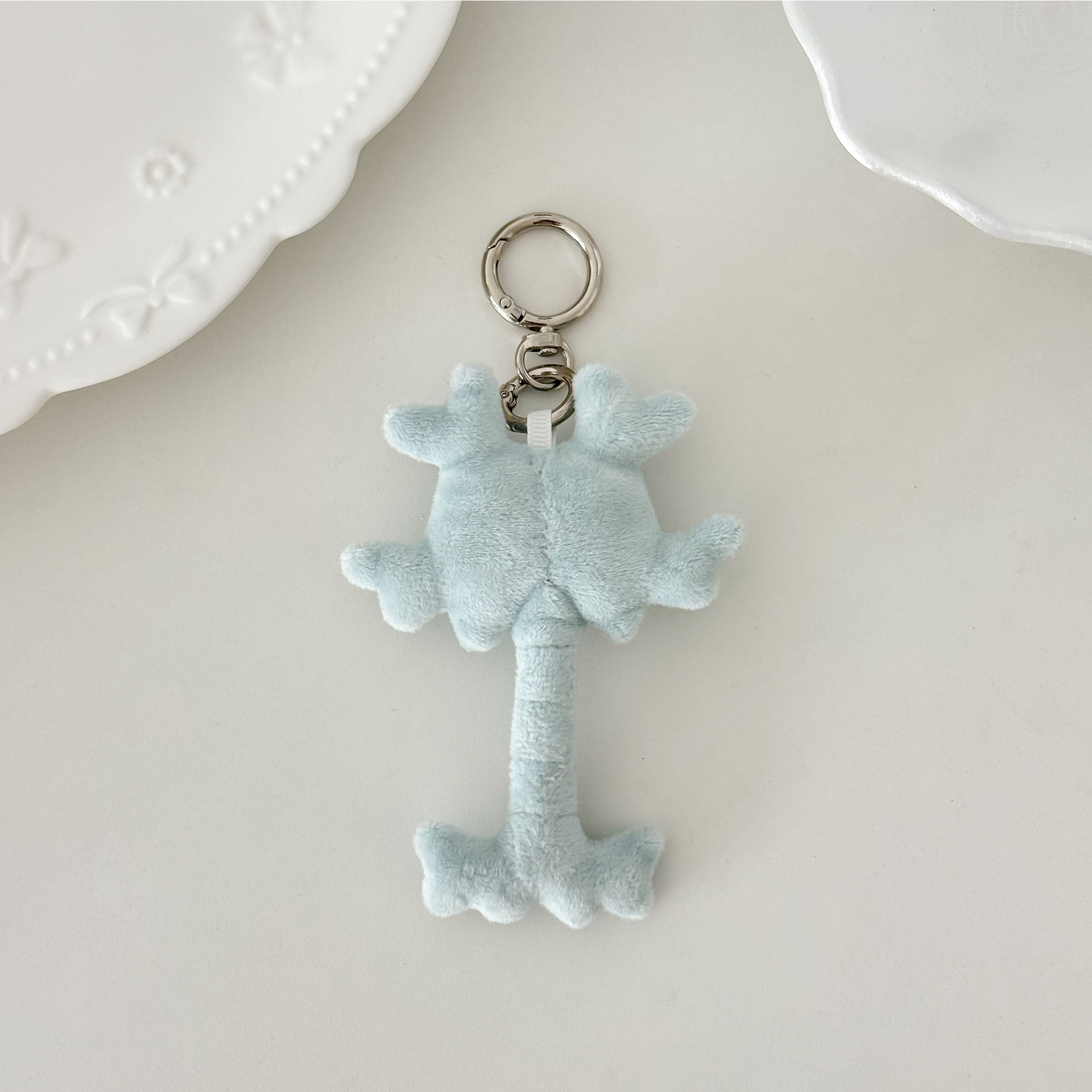 Adorable anatomy neuron plush keychain with soft fabric, cute face, and silver keychain hardware.