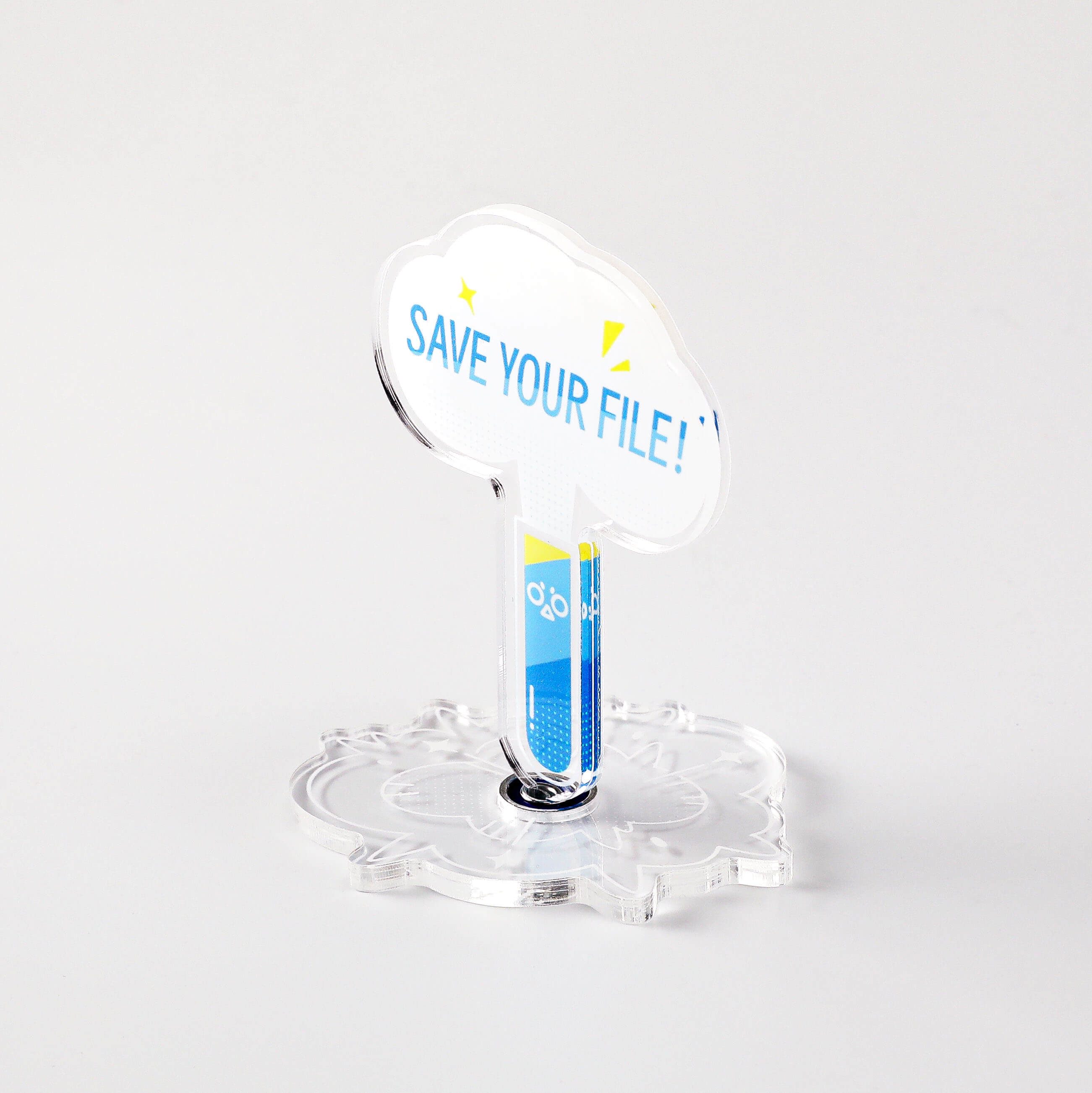 Science-themed acrylic desk stand featuring a blue test tube character and "SAVE YOUR FILE!" message.
