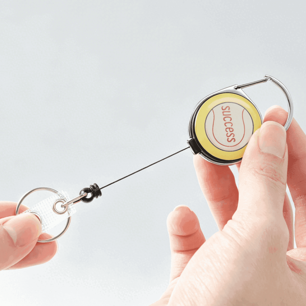Close-Up of Yellow Baseball Retractable Badge Reel with Durable Extendable Cord for Work ID Cards