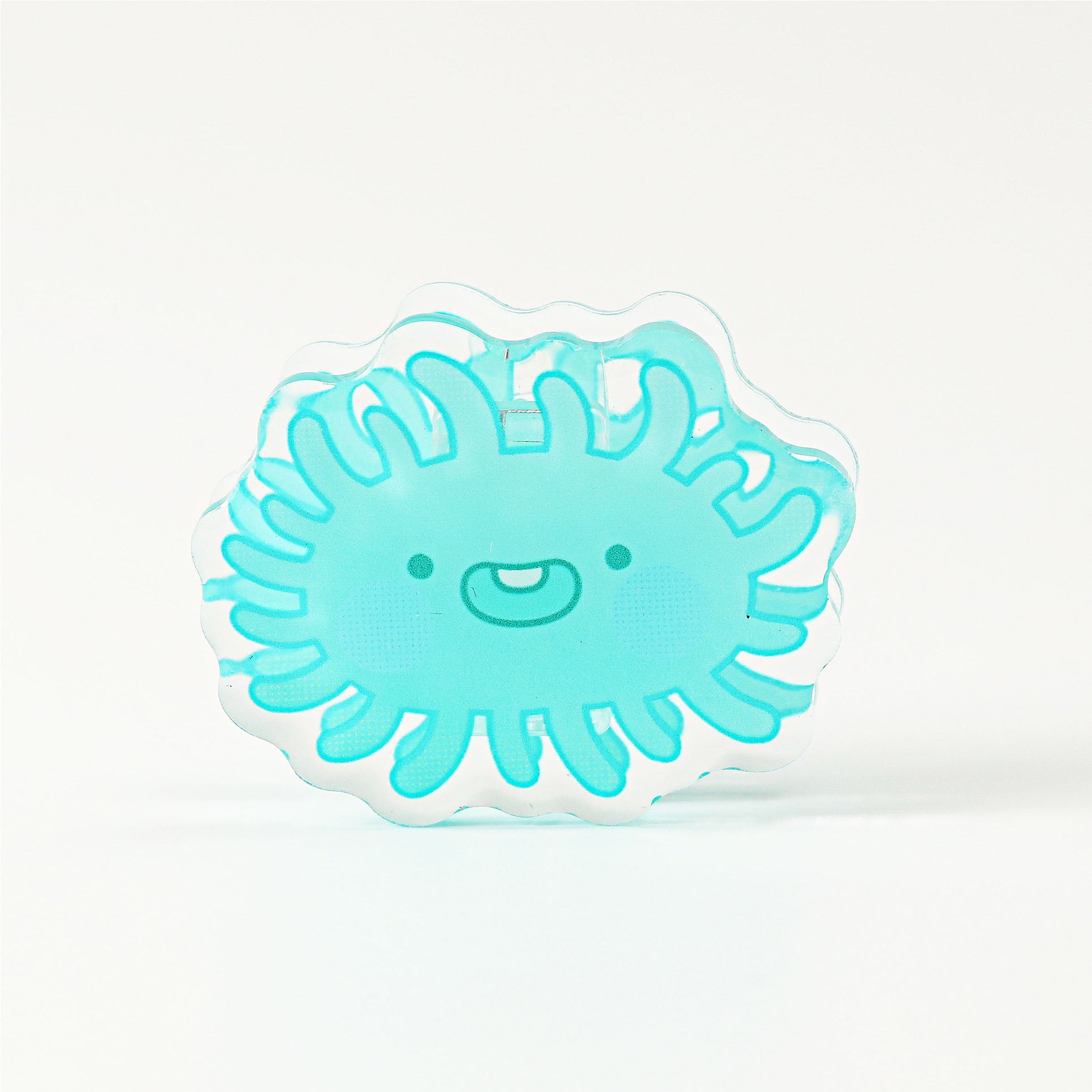 Adorable blue bacteria acrylic page clip featuring a clear layered finish, perfect for decorating books, journals, and office paperwork.