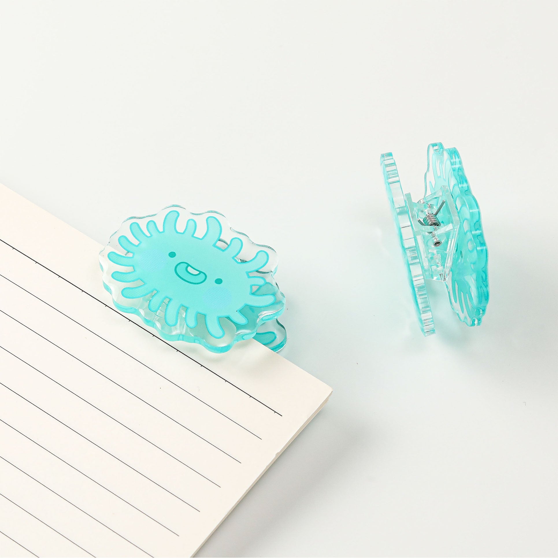 Fun laboratory microbe acrylic document clip with a cute smiling character, a charming stationery accessory for science lovers and everyday organization.