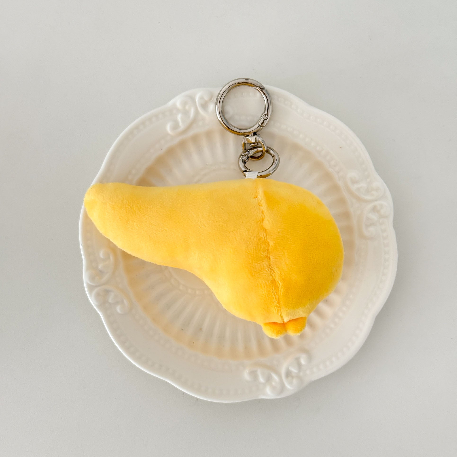 Soft pancreas anatomy plush keychain featuring a cute embroidered face and cuddly organ design.