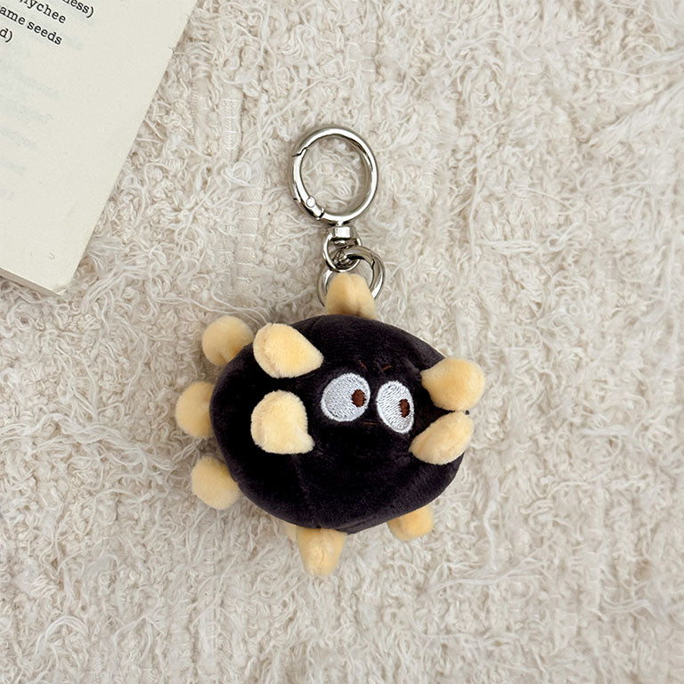 Black virus plush keychain featuring a cute cartoon germ design for backpacks and keys.