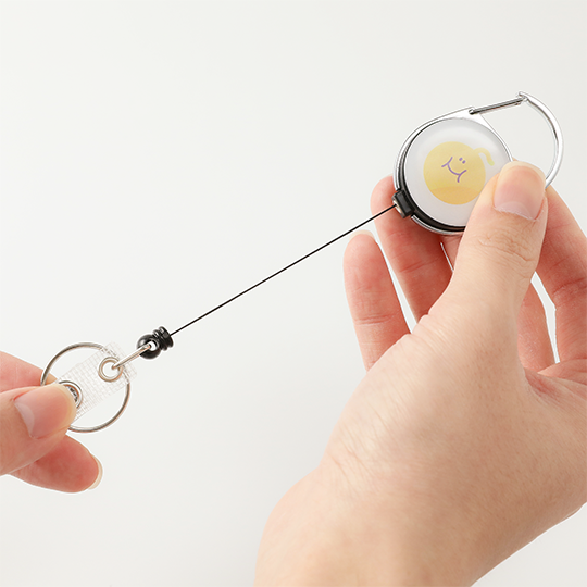 Compact Retractable ID Badge Reel with Smiling Microbe Design and Strong Pull Cord for Daily Badge Access