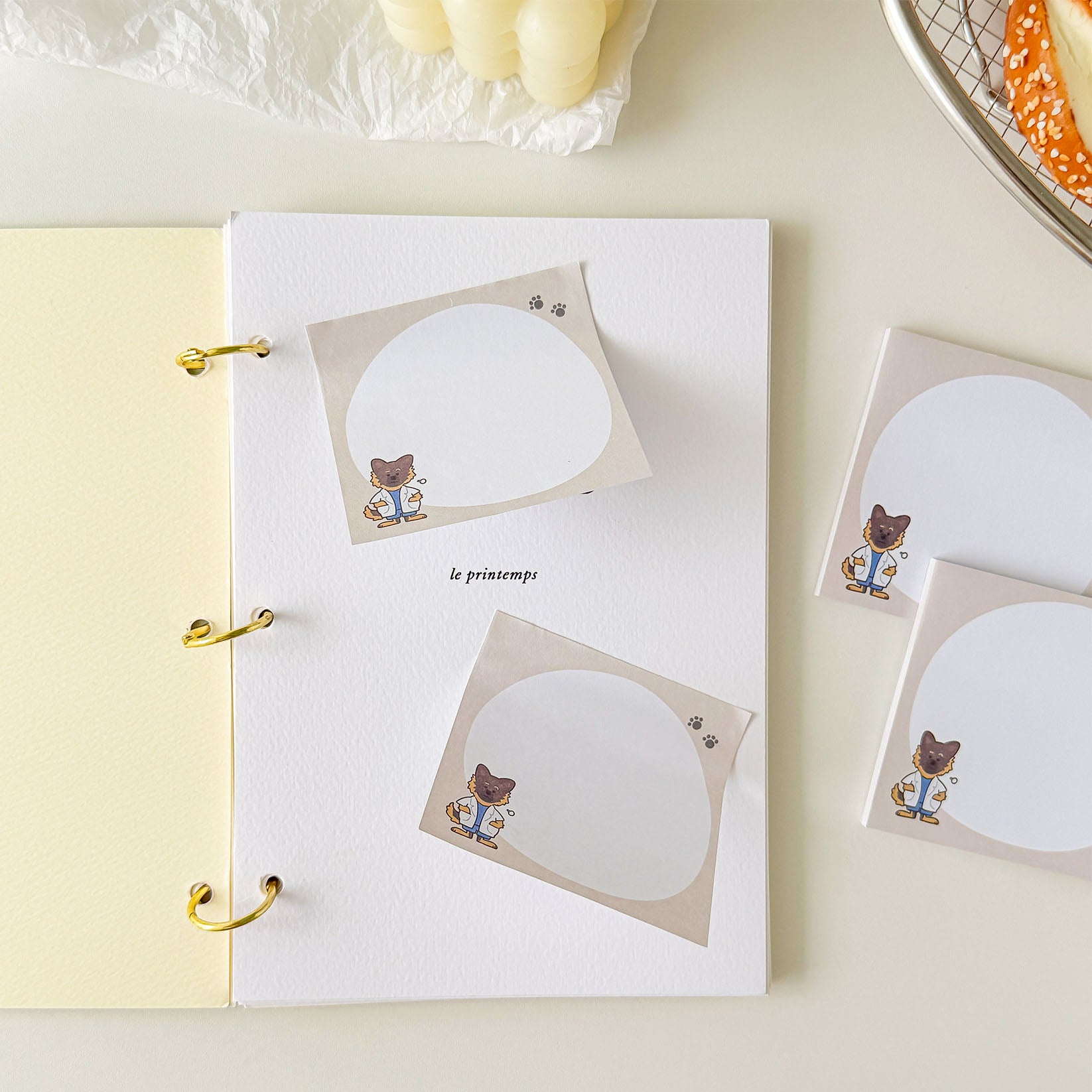 Cute khaki memo sticky notes decorated with a researcher dog illustration and paw print details for everyday writing.