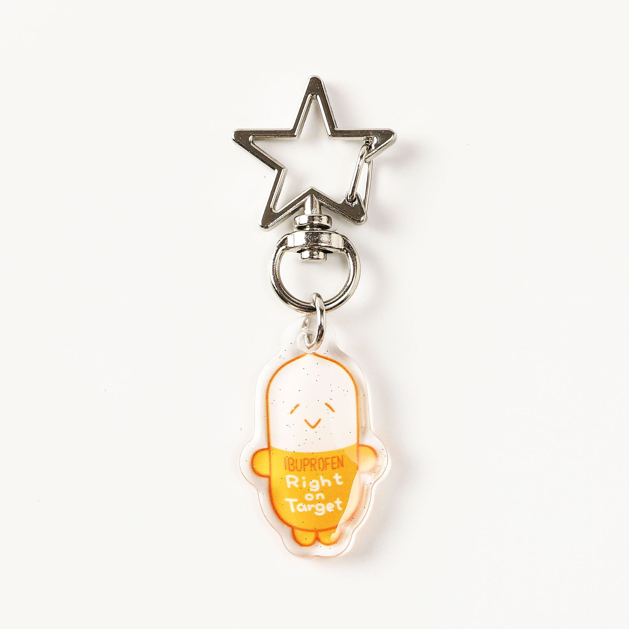 Cartoon ibuprofen acrylic charm keychain featuring a cheerful capsule design with a transparent finish, perfect for decorating tote bags, lanyards, and everyday carry items.