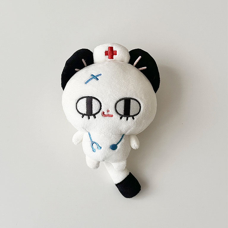 Cute nurse cat plush toy with white fur, embroidered details, and medical-themed outfit.