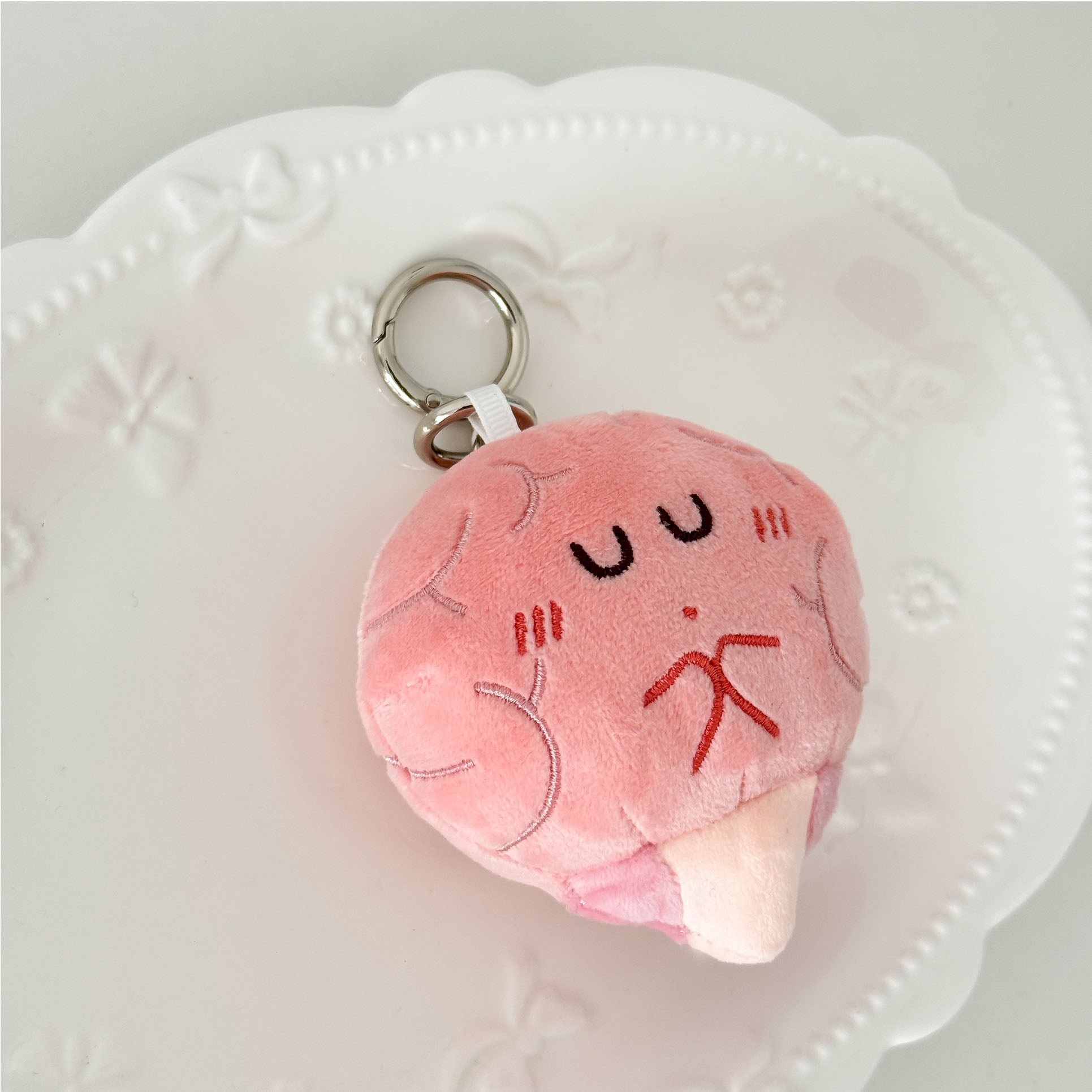 Brain organ stuffed keychain with fluffy plush texture and secure metal ring attachment.