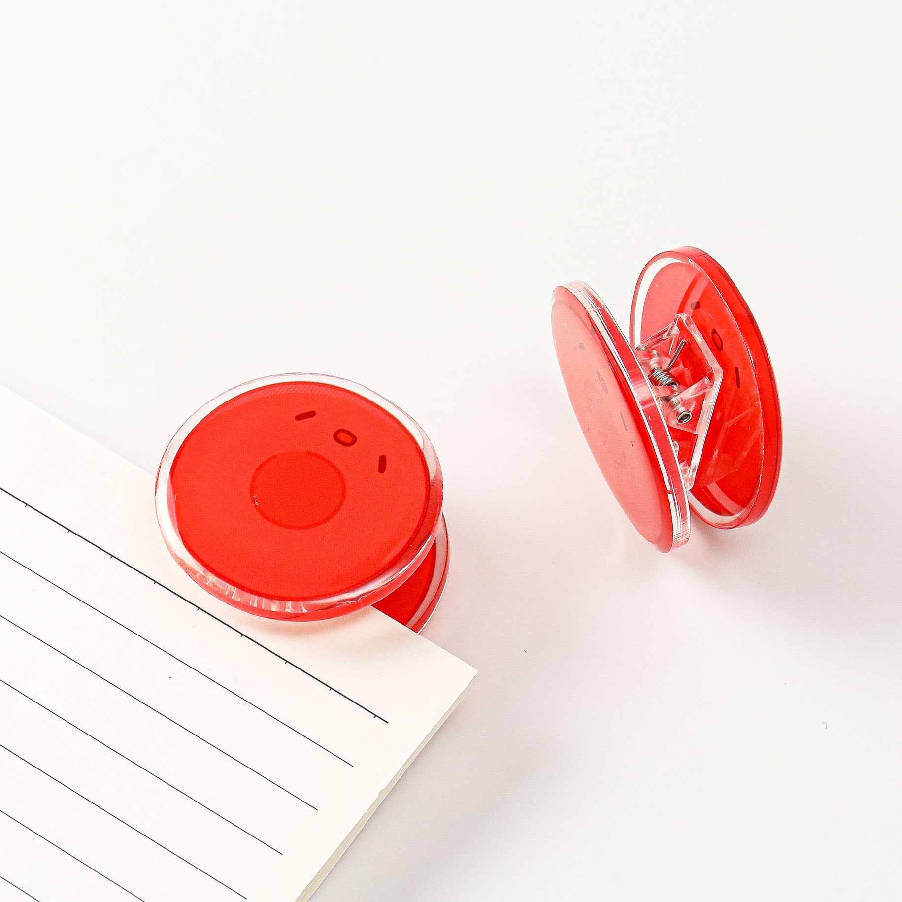 Science-themed red blood cell acrylic stationery clip with a vibrant circular design, a practical desk accessory for classrooms, offices, and laboratories.